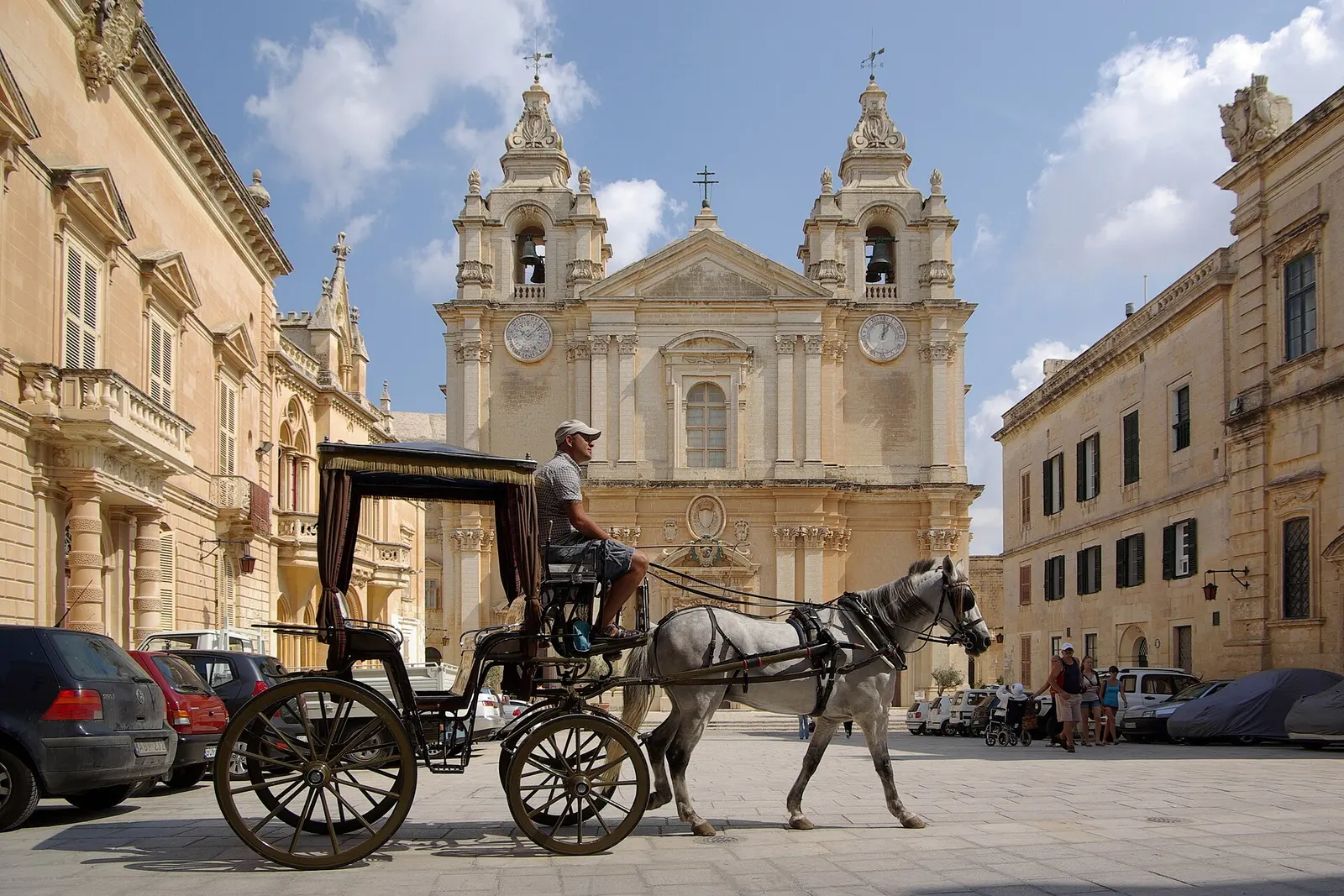 A horse-drawn carriage on the square beside Mdina cathedral