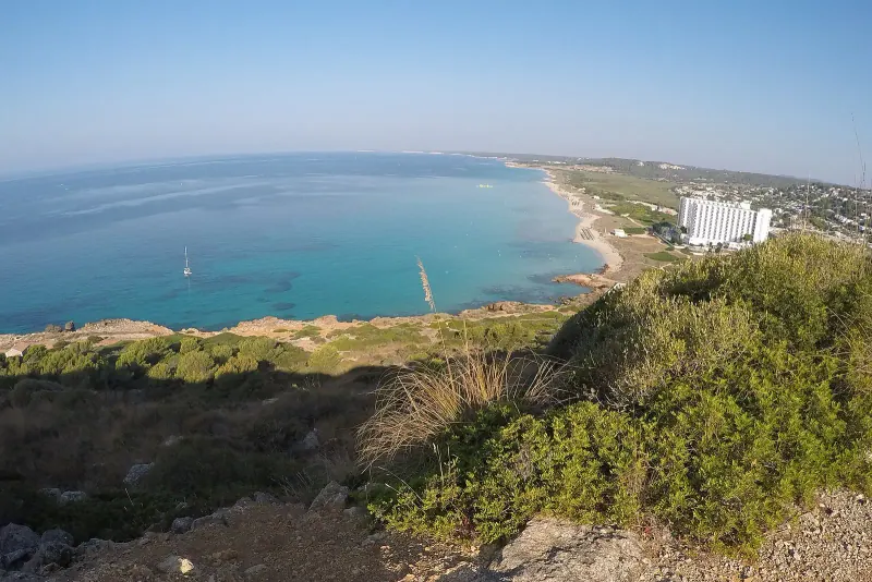 The long pale sands of Son Bou beach on Menorca's south coast