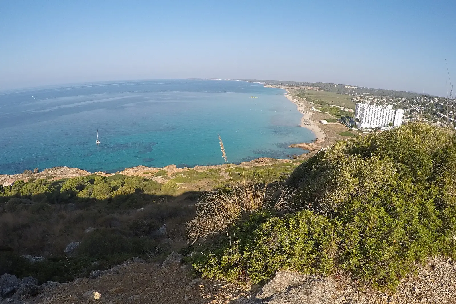 The long pale sands of Son Bou beach on Menorca's south coast