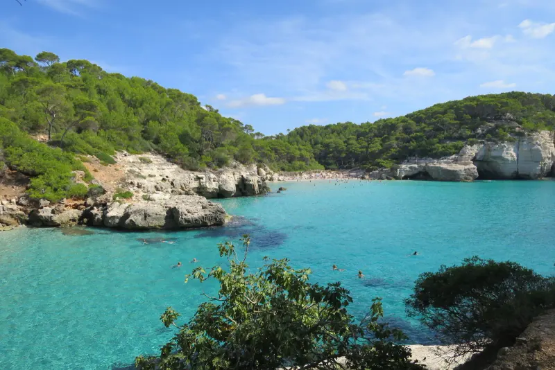 The pine-framed cove of Cala Mitjana on Menorca's south coast