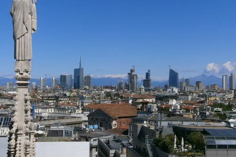 Milan's skyline and the Alps seen from the cathedral roof