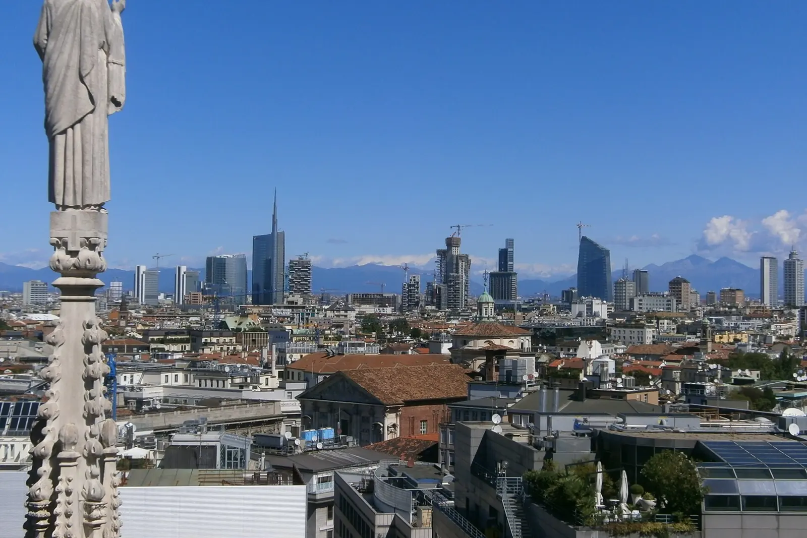 Milan's skyline and the Alps seen from the cathedral roof