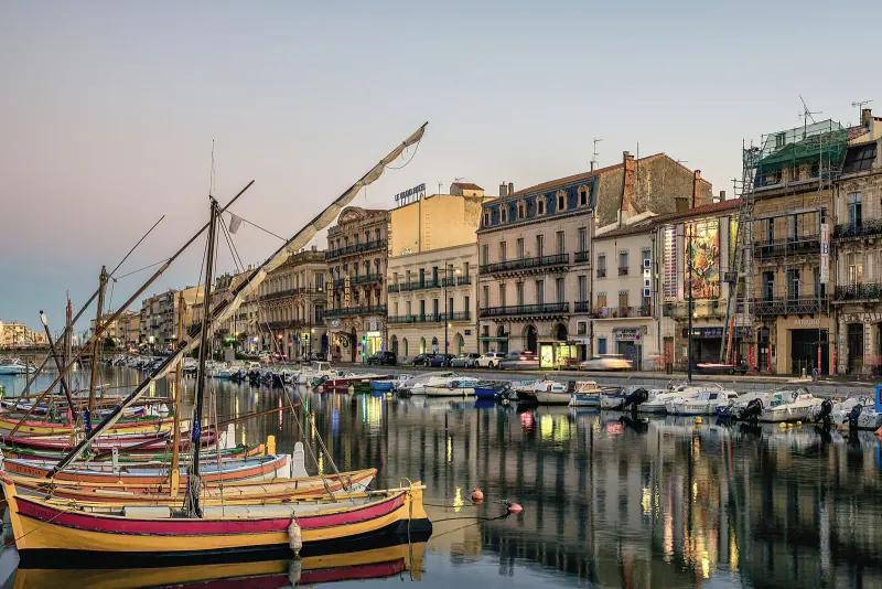 Traditional Catalan fishing boats on a canal in Sète