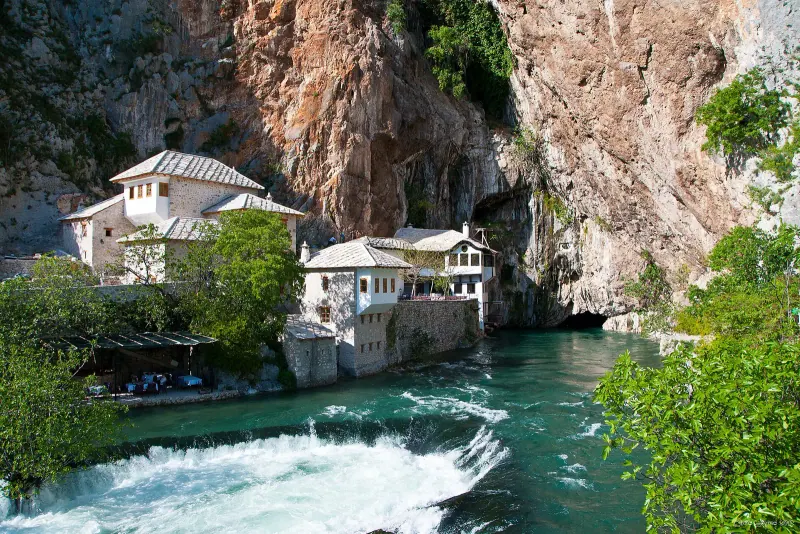 The dervish tekija beneath the cliffs at the Buna spring in Blagaj