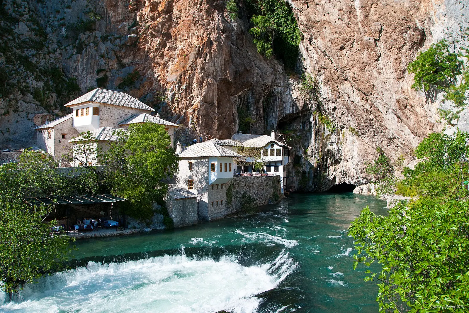 The dervish tekija beneath the cliffs at the Buna spring in Blagaj
