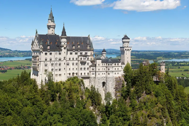 Neuschwanstein Castle on its rocky hill above the Bavarian countryside