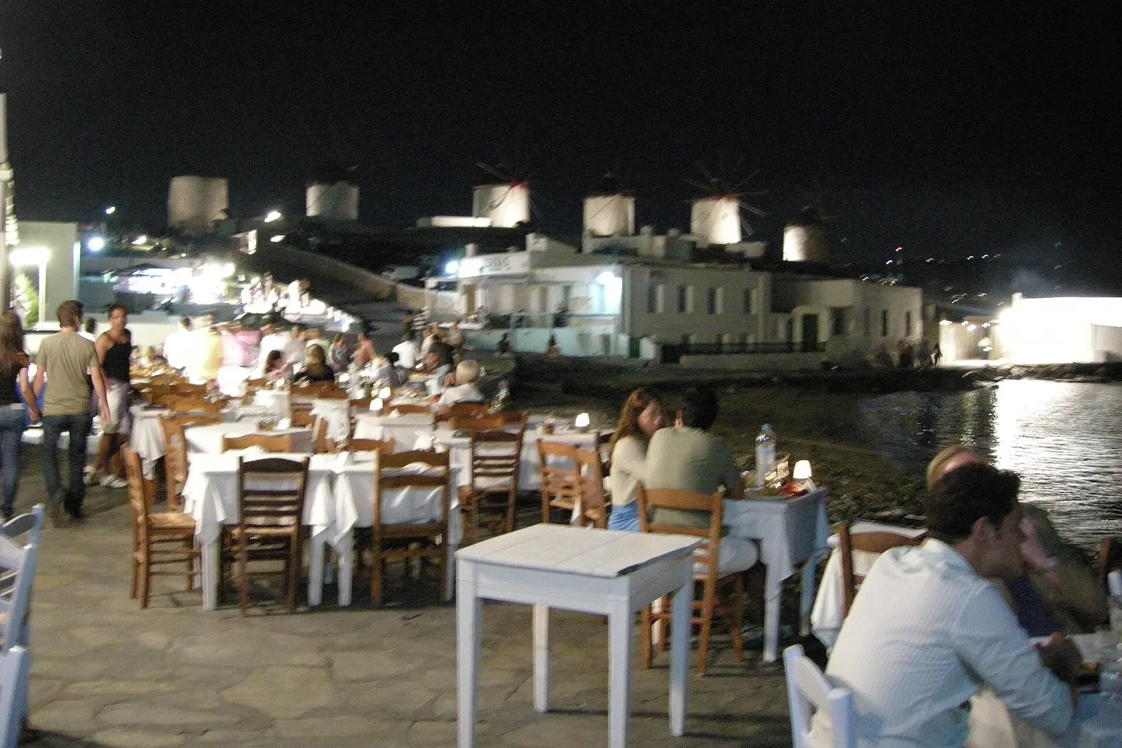 Diners along the Little Venice waterfront at night, Mykonos