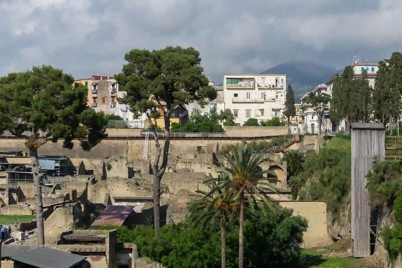 Ruins of Herculaneum with the modern town and Mount Vesuvius behind