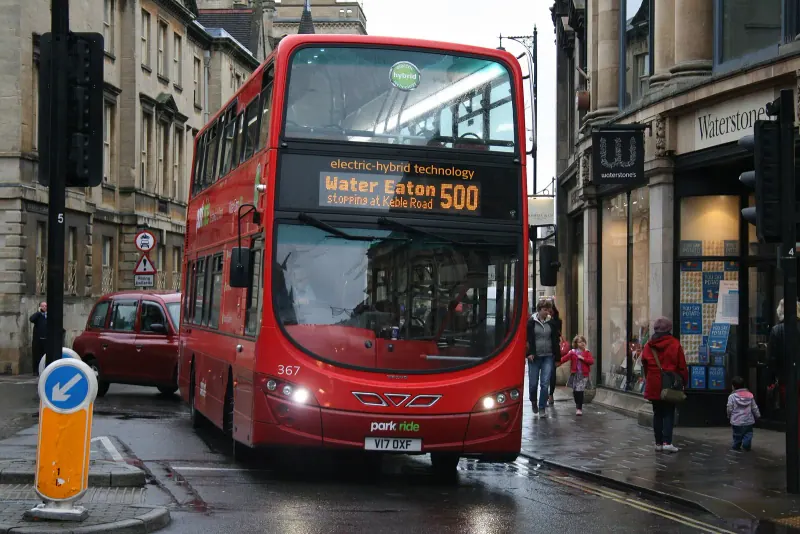 A bus on a shopping street in central Oxford