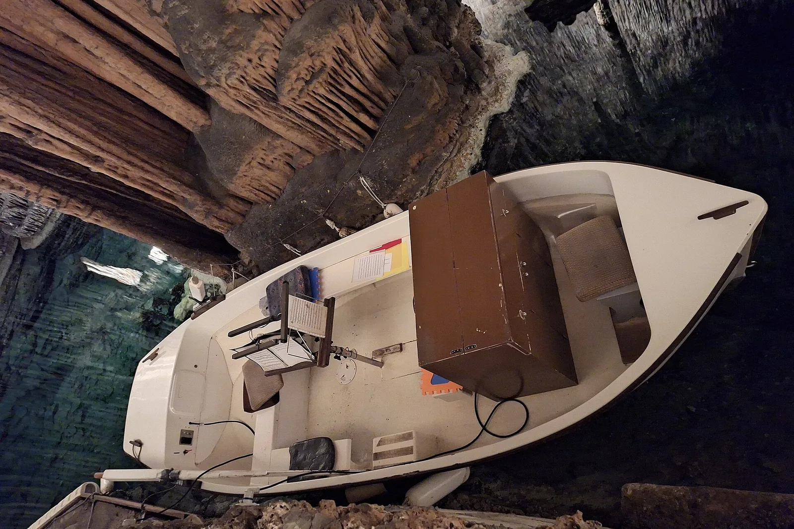 The musicians boat on Lake Martel inside the Drach caves