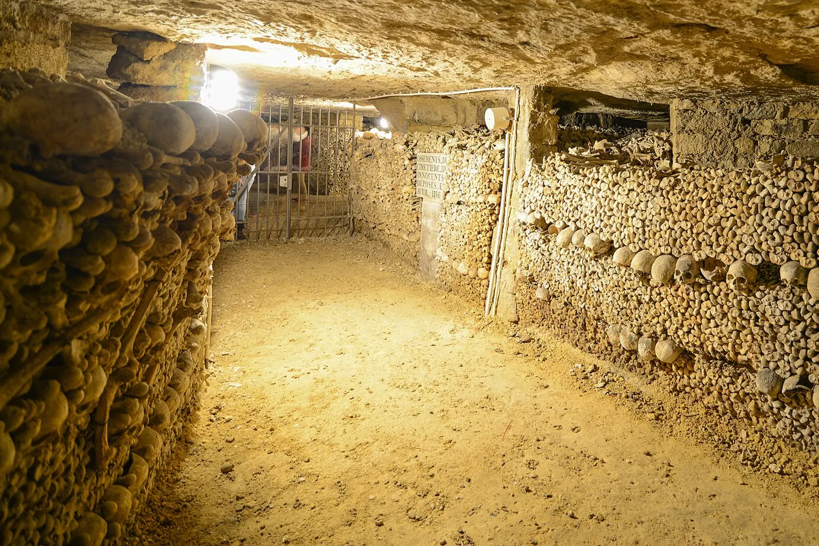 A passage in the Catacombs of Paris lined with stacked bones