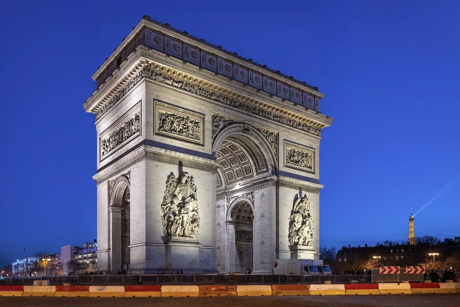 The Arc de Triomphe lit at blue hour
