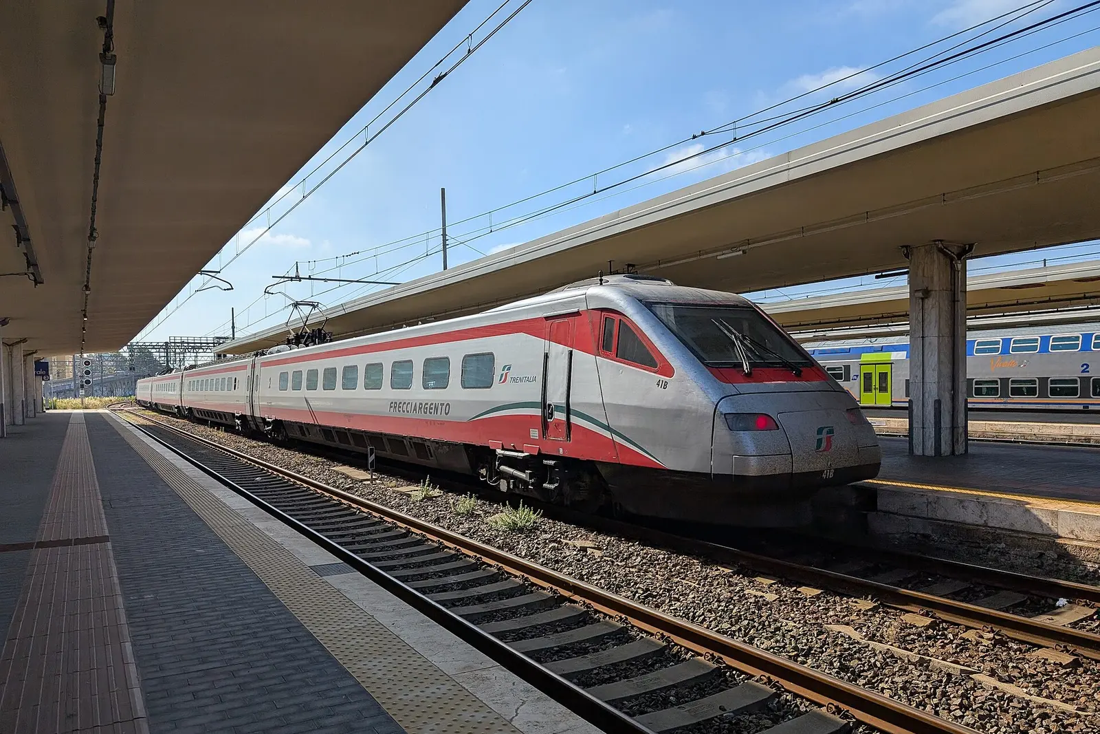 A Trenitalia train at a platform in Pisa Centrale station