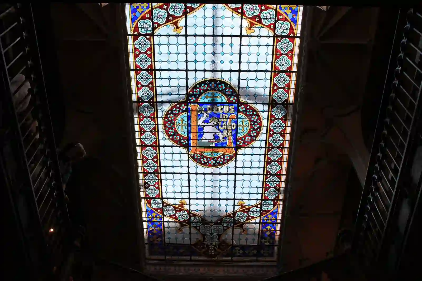 The stained glass skylight inside Livraria Lello in Porto