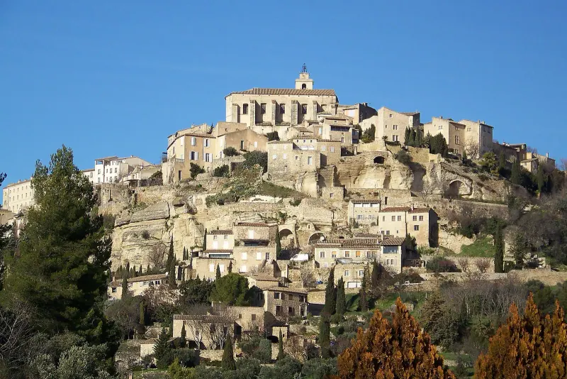 Hilltop stone village of Gordes with its church and houses stacked on the Luberon hillside