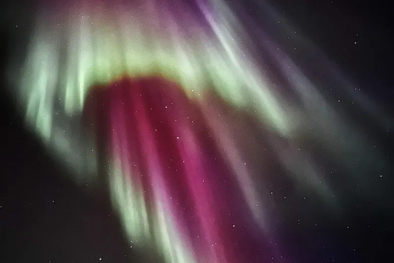 Pink and green northern lights over Iceland