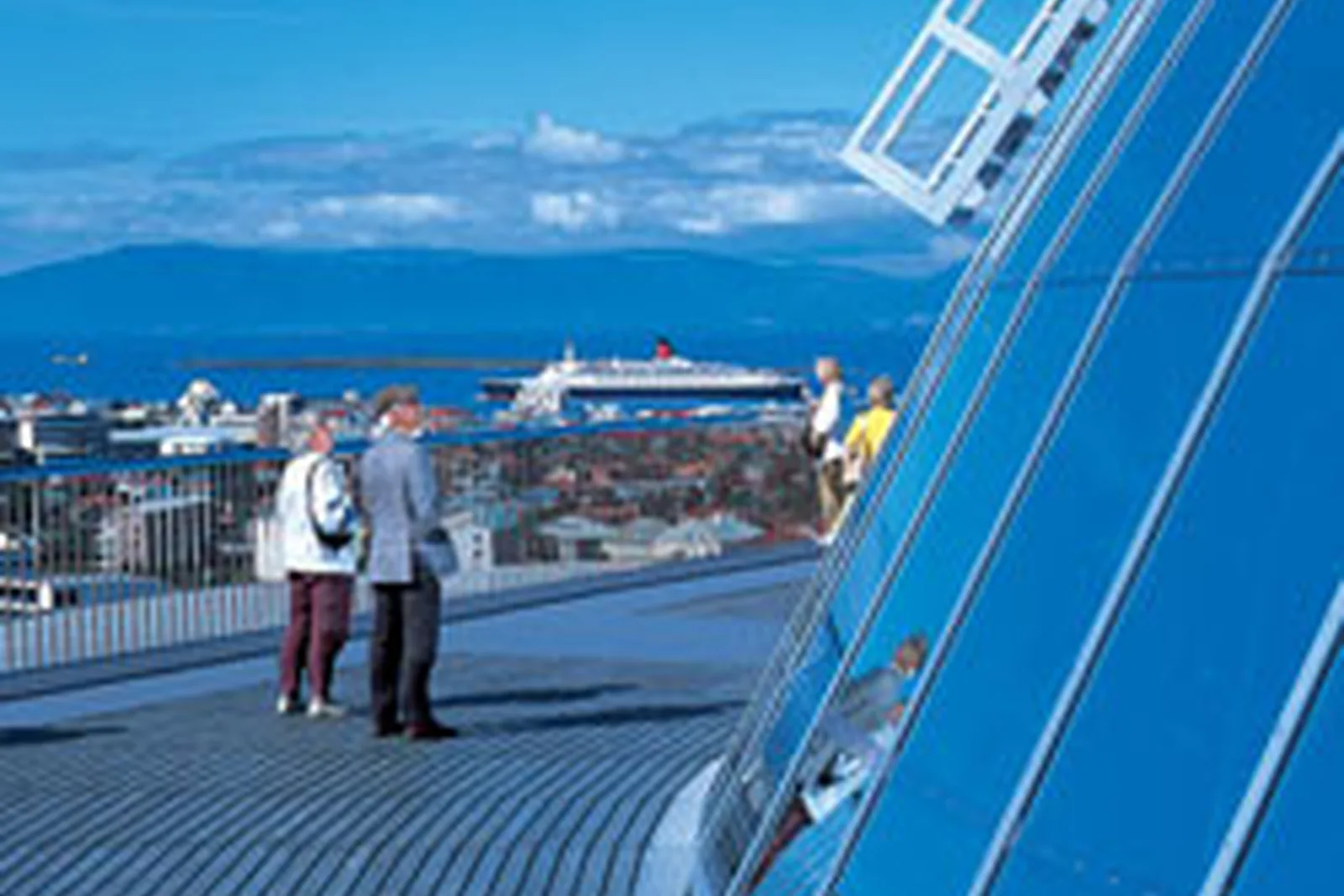 Visitors on the Perlan viewing deck overlooking Reykjavik