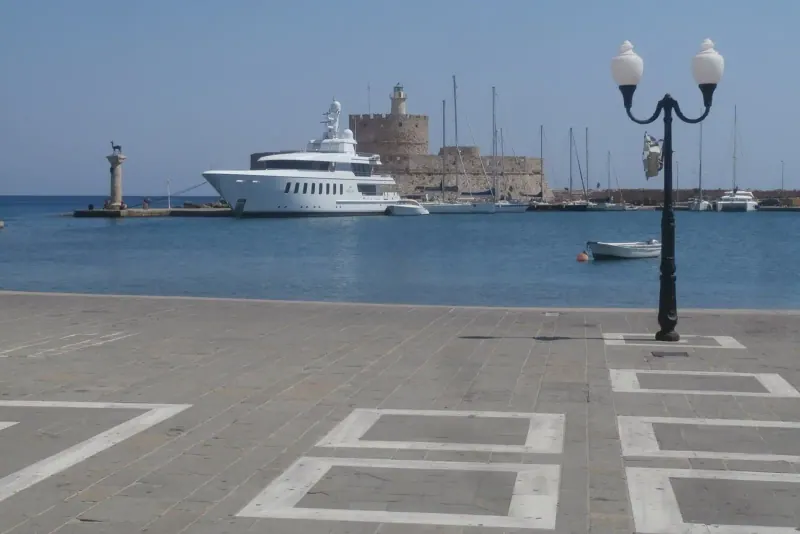Mandraki harbour with the St Nicholas lighthouse, Rhodes