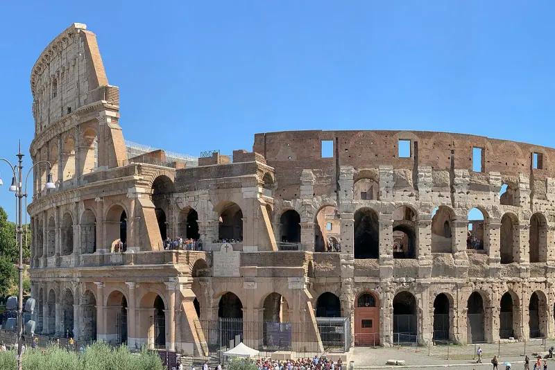 The outer wall of the Colosseum on a clear day