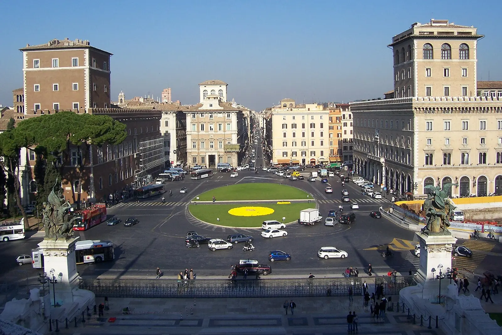 Piazza Venezia seen from above, with traffic circling the central lawn