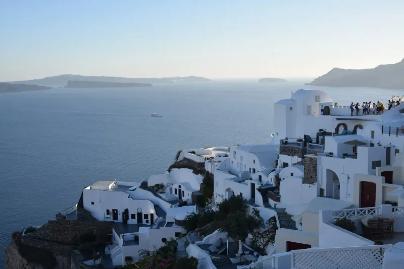 White houses of Oia stacked above the caldera, Santorini