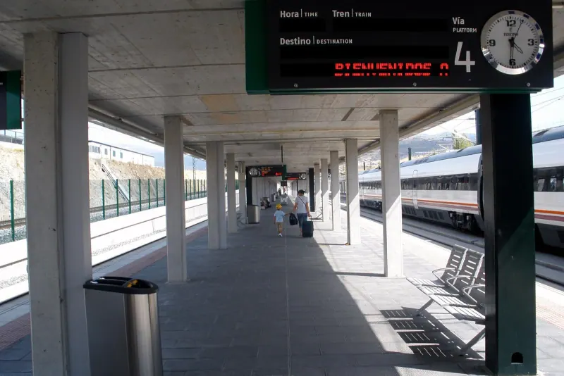 A high-speed train waiting at the platform of Segovia-Guiomar station