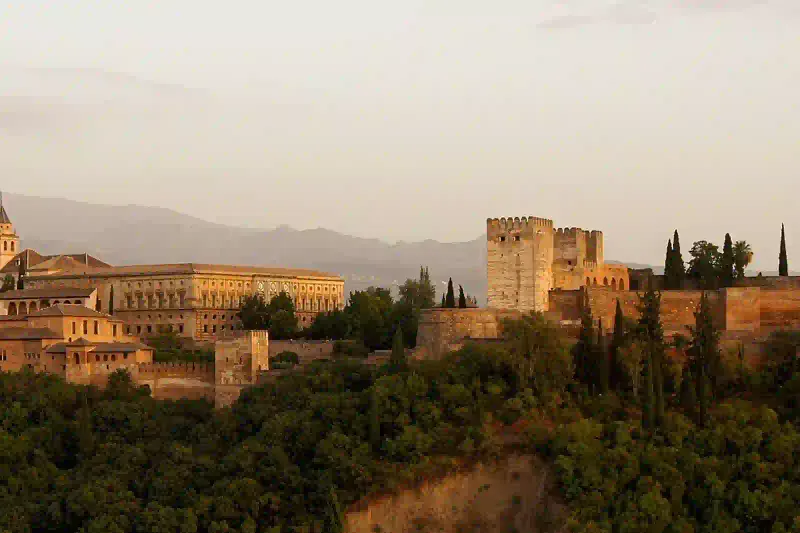 The Alhambra palace above Granada seen in the evening