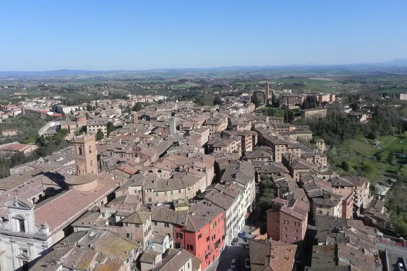Aerial view over Siena's rooftops towards Piazza del Campo