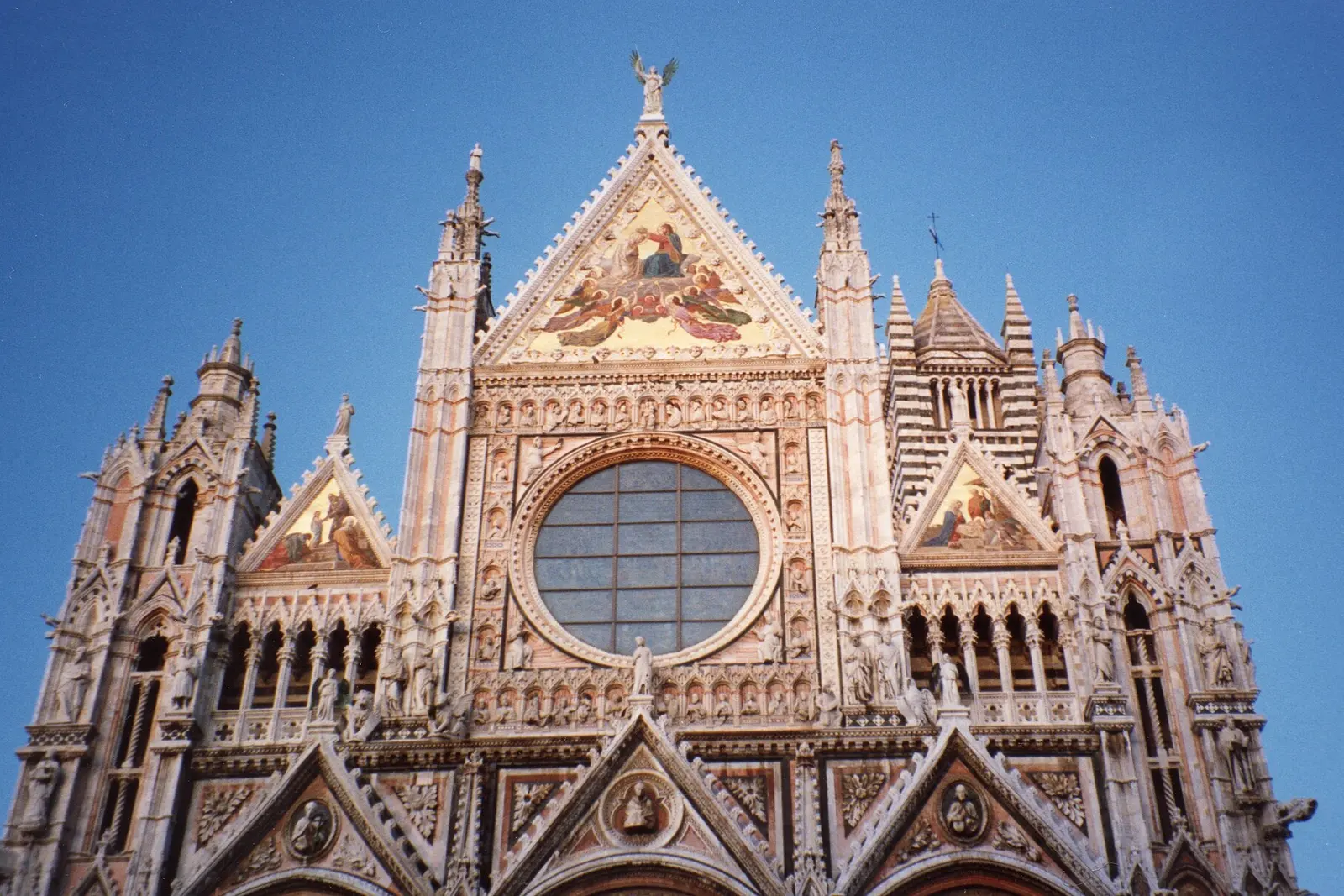 The striped marble facade of Siena Cathedral