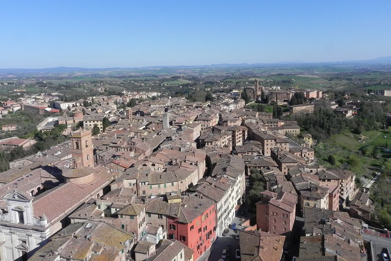 Aerial view over Siena's rooftops towards Piazza del Campo