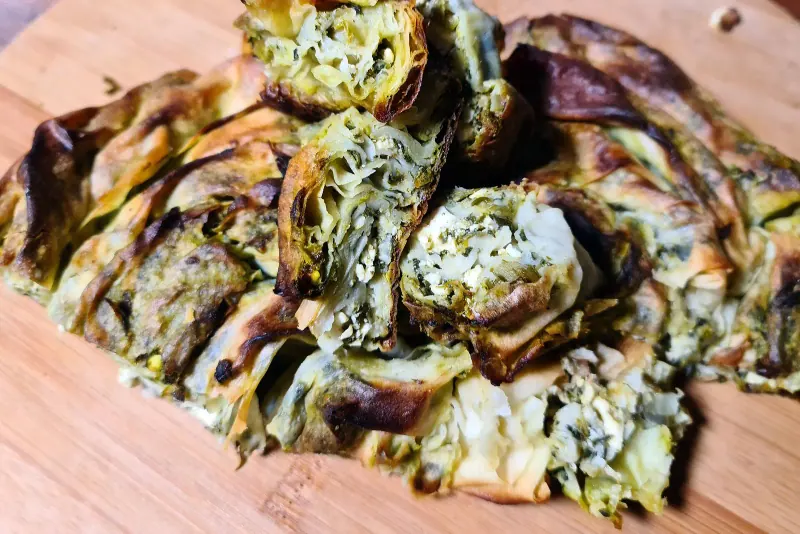 Fresh banitsa and Bulgarian pastries on a bakery counter