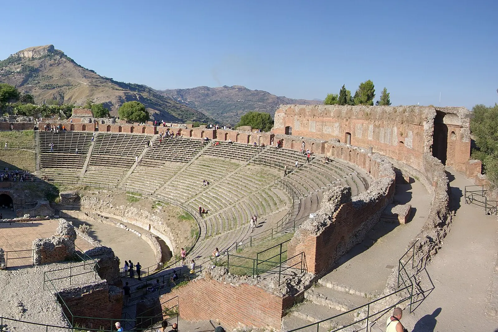 The stage of Taormina's Greek theatre with the sea beyond