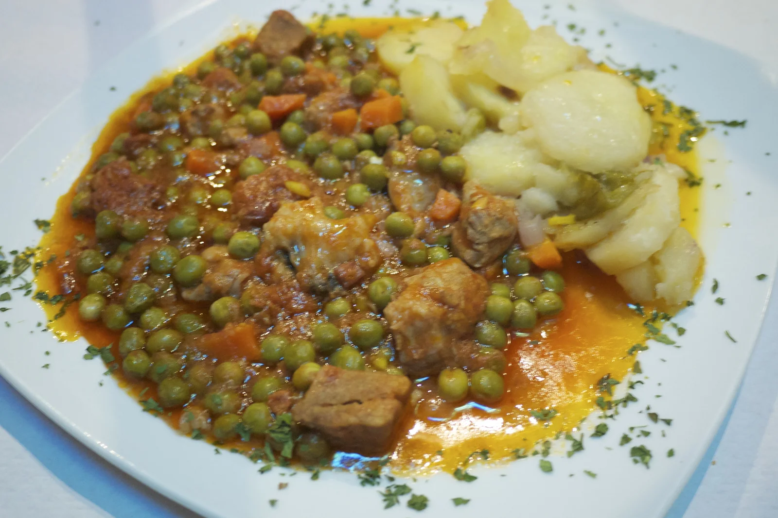Carcamusas, Toledo's signature pork and tomato stew, served in a clay dish