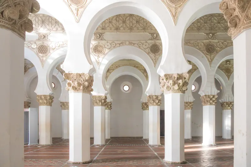 Whitewashed horseshoe arches inside Santa Maria la Blanca synagogue