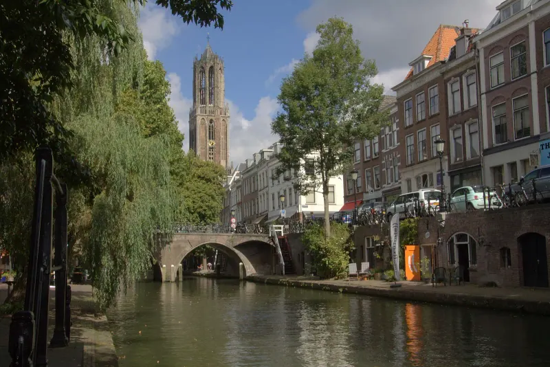 The Dom Tower over an Utrecht canal