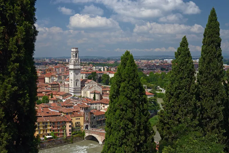 Verona and the Adige seen through cypresses from Castel San Pietro