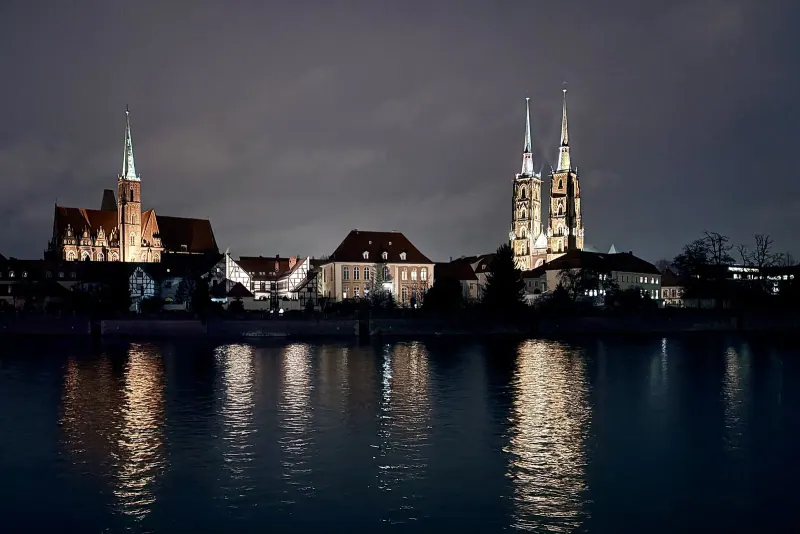 Wroclaw Cathedral on Ostrow Tumski lit at night above the Oder