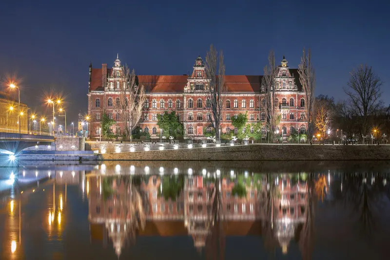 Wroclaw National Museum lit at night on the Oder bank