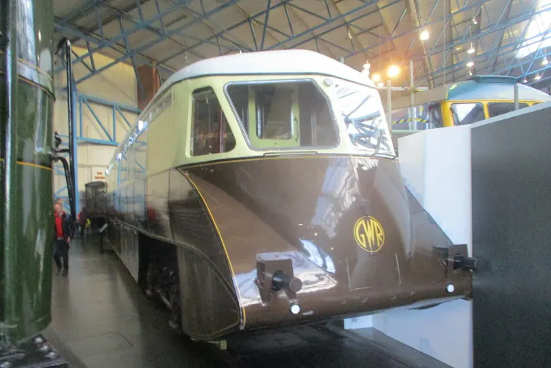 A streamlined 1930s railcar inside the National Railway Museum in York