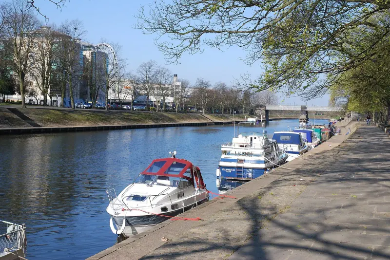 Boats moored on the River Ouse beside Lendal Bridge in York