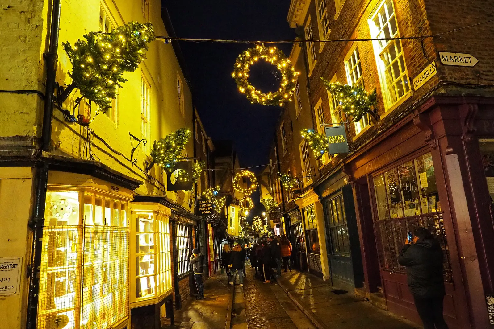 The Shambles in York lit warmly at night