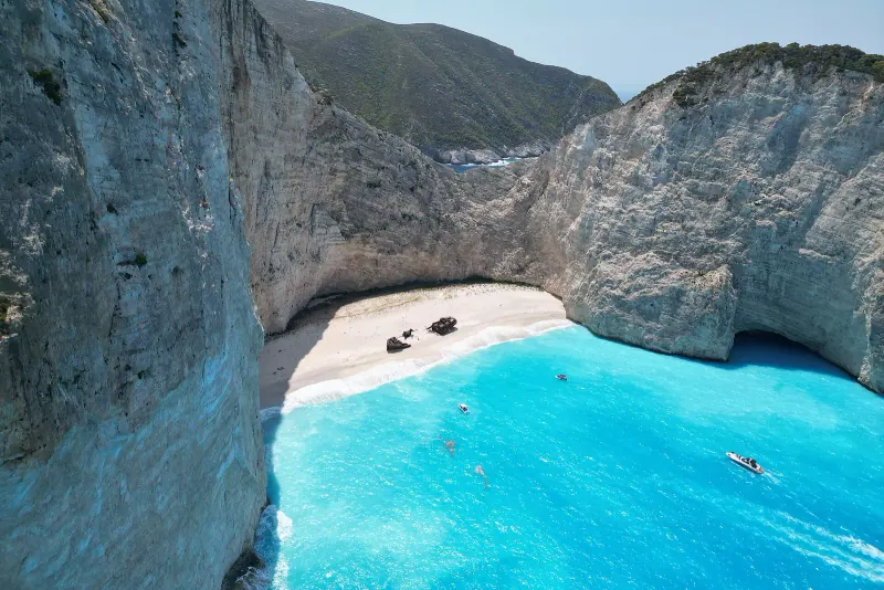 Navagio beach in a white limestone cove with turquoise water on Zakynthos