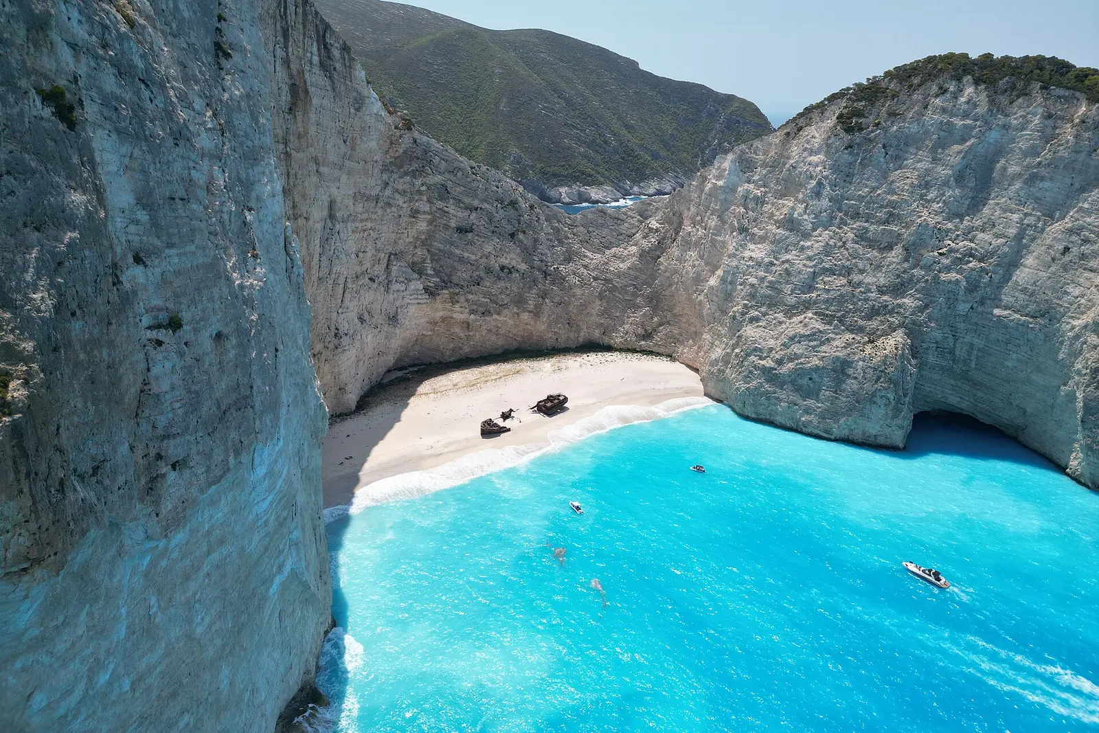 Navagio beach in a white limestone cove with turquoise water on Zakynthos